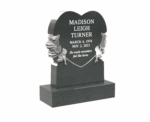 Heart-Shaped Memorial Headstone with Floral Engraving in a Peaceful Cemetery